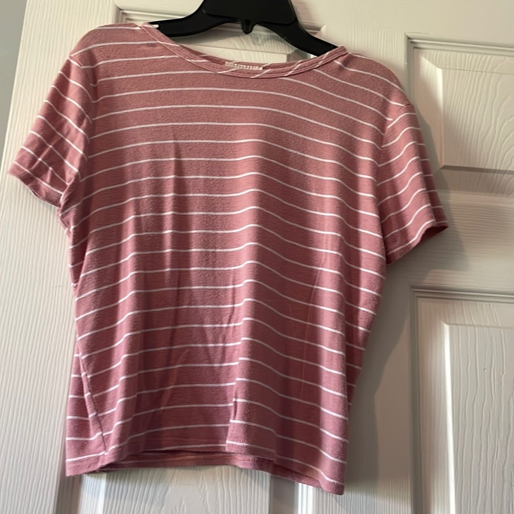 Large in junior size it fit me really well when In middle school/high school